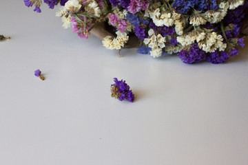 Bright table with a beautiful bouquet of flowers. holiday concept such as March 8, women's day, Valentine's day, birthday. space for text, top view. the concept florist . flower shop.