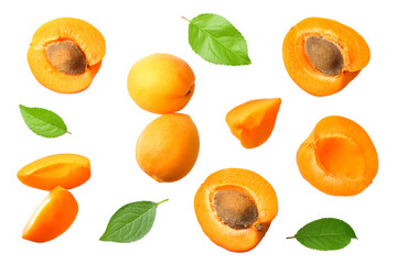apricot fruits with slices and green leaf isolated on white background. top view