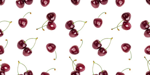 Obraz na płótnie Canvas Seamless pattern of red cherry berries on white background isolated close up, beautiful burgundy bing cherries berry decorative ornament, fresh ripe tasty fruits wallpaper, summer backdrop art design