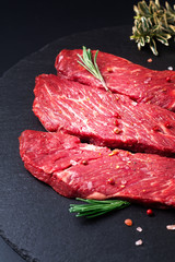 Food concept organic raw meat filet beef steak on black slate stone background