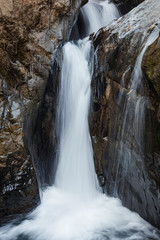 Waterfall on the rocks in rainforest