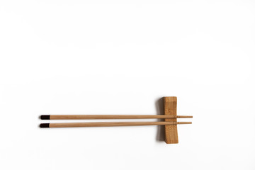 Wooden pairs of chopsticks on white background. cooking culture in Asian countries.