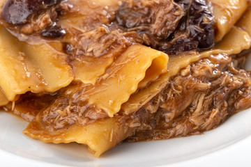Traditional italian pasta. Homemade freshness pappardelle. Pasta with with a rabbit. Homemade delicious italian traditional pasta on wooden table for dinner. italian cuisine.