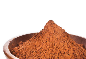 Cocoa powder in the wooden bowl isolated on a white background.