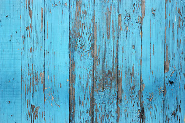 Fototapeta na wymiar Vintage wood background with peeling paint. Fence made of boards
