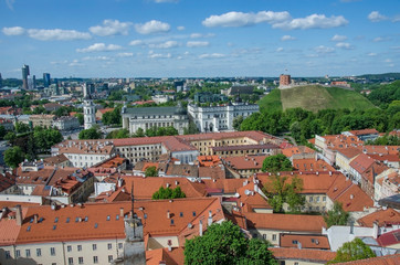 Fototapeta na wymiar View from above of Vilnius, Lithuania. View of St. Stanislaus Cathedral on Cathedral Square, Gediminas castle on the hill, red rooftops.