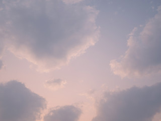 puffy fluffy clouds sun light in spring evening with blue sky horizontal , abstract nature background