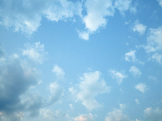 Heart shape space blue sky horizontal with beautiful puffy fluffy clouds in spring evening,...