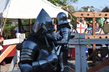 Two knights with flails after tilting on a medieval festival in Vyborg, Russia