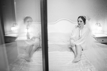 morning of a beautiful bride in a delicate white coat