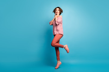 Full length body size view of her she nice attractive amazed cheerful cheery feminine brown-haired girl having fun posing isolated over bright vivid shine vibrant blue color background