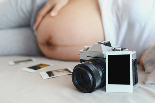 empty blank picture photo with camera for design your memories image of mother pregnant with love a baby in fetus