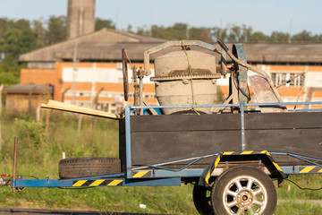 A concrete mixer transported on a trailer