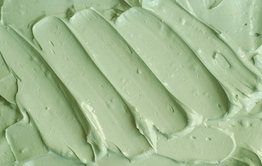 Green cosmetic clay (avocado facial mask, cucumber face cream, body wrap) texture close up,...