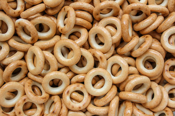Background with a scattering of bread bagels and dries