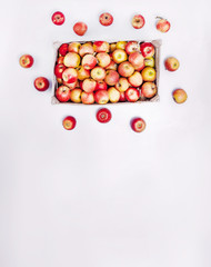 a box of many red apples on top