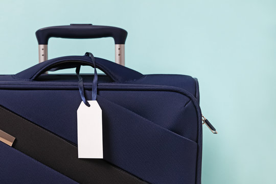 Empty Paper Luggage Label On Blue Suitcase