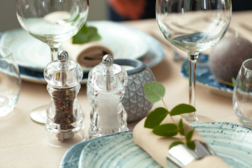 Table setting set with candles and plant branches