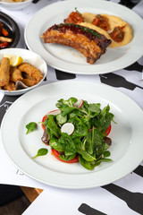 Delicious fresh salad. Spinach and Tomato Salad. salad with fresh vegetables. Close up view on Salad. Healthy, diet tasty summer dish
