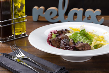 Delicious fresh salad. warm salad with liver. Restaurant food, close up. Meat salad. Close up view.