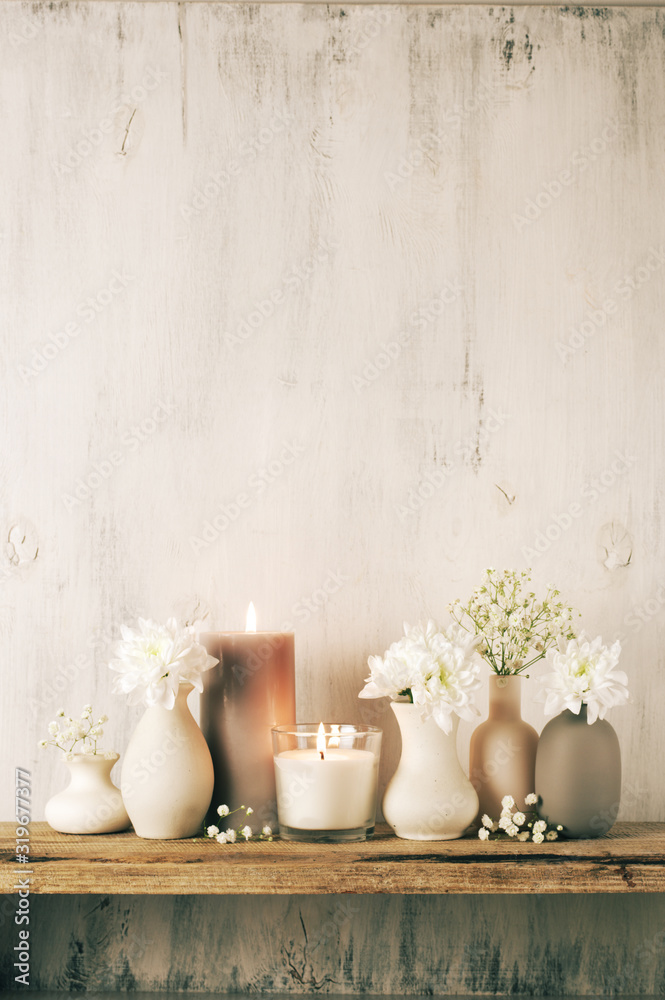 Poster white flowers in neutral colored vases and candles