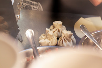 Fototapeta na wymiar Process of preparing khinkali in a cafe close up