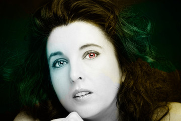 Young attractive woman with long black hair on dark background