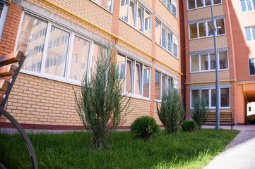 Modern and new apartment building. Multistoried, modern, new and stylish living block of flats. Real estate. New house. Newly built block of flats