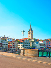 Zurich city center and Limmat quay in summer with St Peter clock tower in summertime, Switzerland