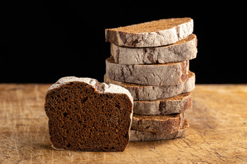 Still life with bread, spikelets. Slices of fresh bread ready to be used. Fresh homemade baked bread and sliced bread.