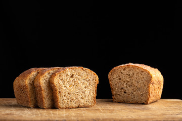 Still life with bread, spikelets. Slices of fresh bread ready to be used. Fresh homemade baked bread and sliced bread.