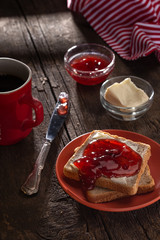Crispy toast with butter, jam. fried crispy toasts with red jam on a table. breakfast. 