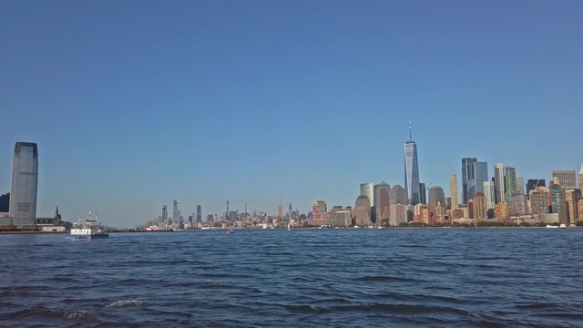 Touristic boat and Lower Manhattan panoramic view