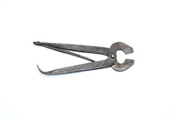 Vintage old rusty metal pincers isolated on white background