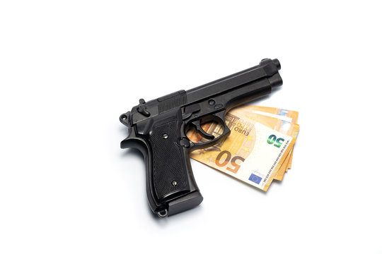Gun and euro banknotes isolated on white. Pistol and money. Crime concept.