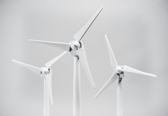 Three wind turbines on white background