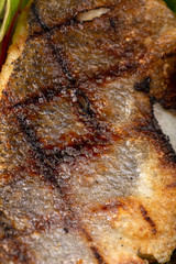 Oven-baked Sea bass. grilled fish.