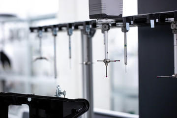 Close up of professional automatic 3D measuring system machine for plastic moldings, industrial and automotive concept