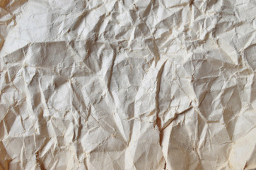 Creative background with scattered overlay of crumpled papers.