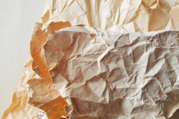 Creative background with scattered overlay of crumpled papers.