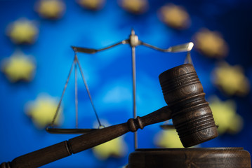 Law and Justice concept. UE flag background, place for typography. Courtroom Europe theme.