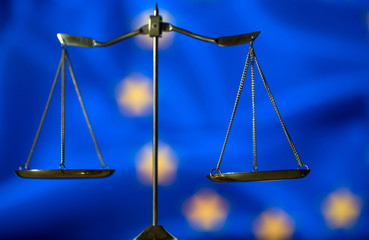 Law and Justice concept. UE flag background, place for typography. Courtroom Europe theme.