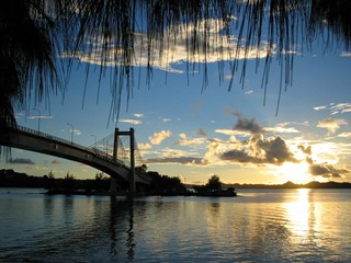 Sunset reflected in the waters with the Japan-Palau Friendship Bridge in view.