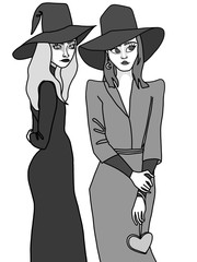 Two fashionable witches standing next to each other