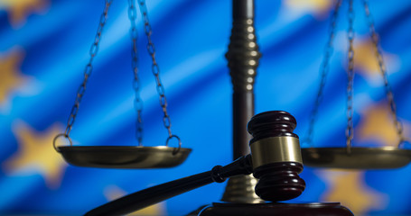 Obraz premium Law and Justice concept. UE flag background, place for typography. Courtroom Europe theme.