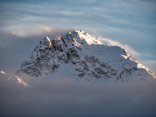 Natural background of mountain summit in clouds. Mount peak Anchkho in Abkhazia (Caucasus)
