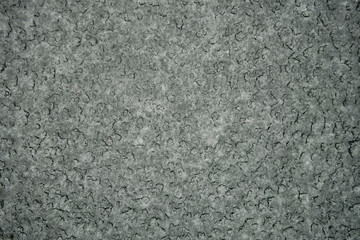 Iced car windshield in incelemental winter weather requiring de-icing
