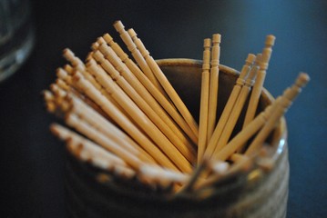 Soft shot of toothpicks in a round canister.