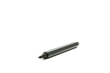 A black pen or marker lies on a blank sheet of paper. On white background