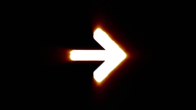 Shiny fire arrow right icon fly in center flickers with rgb spectrum colors and flies away with light trail. Super bright white symbol in motion isolated on black background. 4k 60 fps footage.